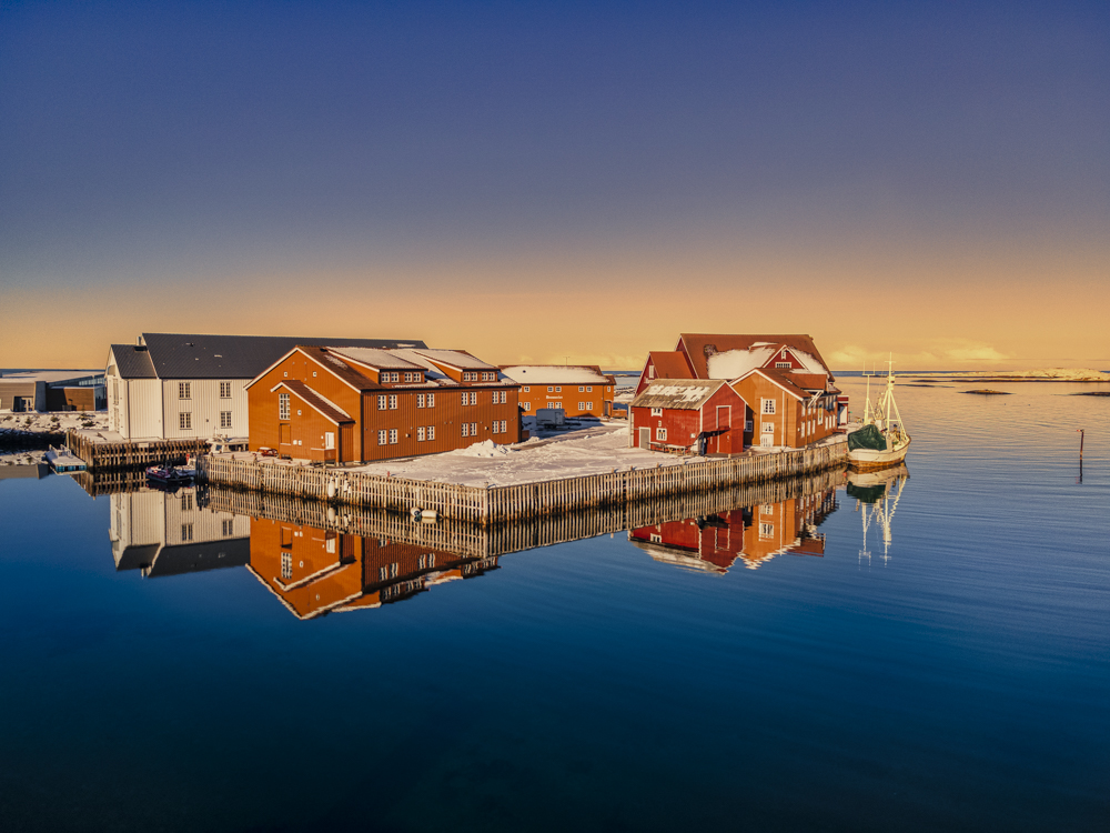 Traditional Norwegian sea warehouses converted into modern hotel rooms at Finnøy Bryggehotell.