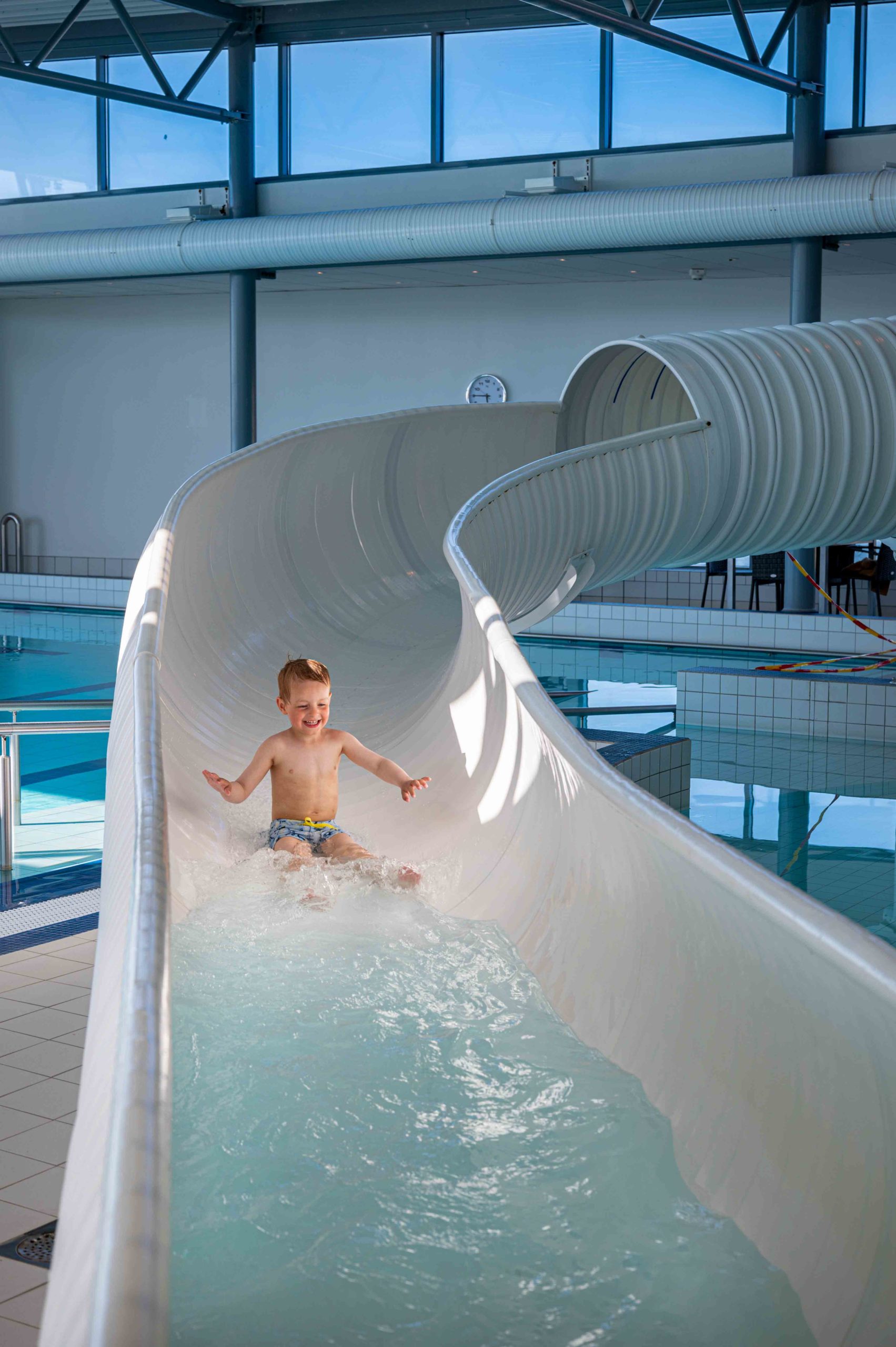 A little boy tries the slide in Håp i Havet